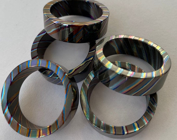 Four alloys Double Zr Mokume Ti (ZrTidamascus) ring blank, 7~12.5 size. Note: the ring blank was not polished and colored yet
