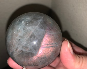 Labradorite sphere with pink & orange flash