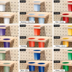 May include: A set of wall-mounted organizers for cups or small items. The organizers come in two styles: single and double. The organizers are available in a variety of colors, including white, sky blue, red, purple, orange, yellow, sage green, blue, and green.