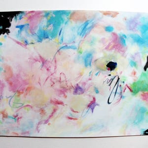 May include: Abstract watercolor painting with a vibrant mix of colors including pink, blue, green, and yellow. The artwork features loose brushstrokes and a dynamic composition, with black accents in the corners and a signature.
