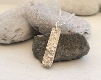 Silver ripple pendant necklace