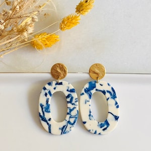 Blue and ivory marbled acetate pendant earrings