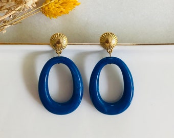 Boucles d'oreilles pendentif goutte en résine bleu et cabochon doré