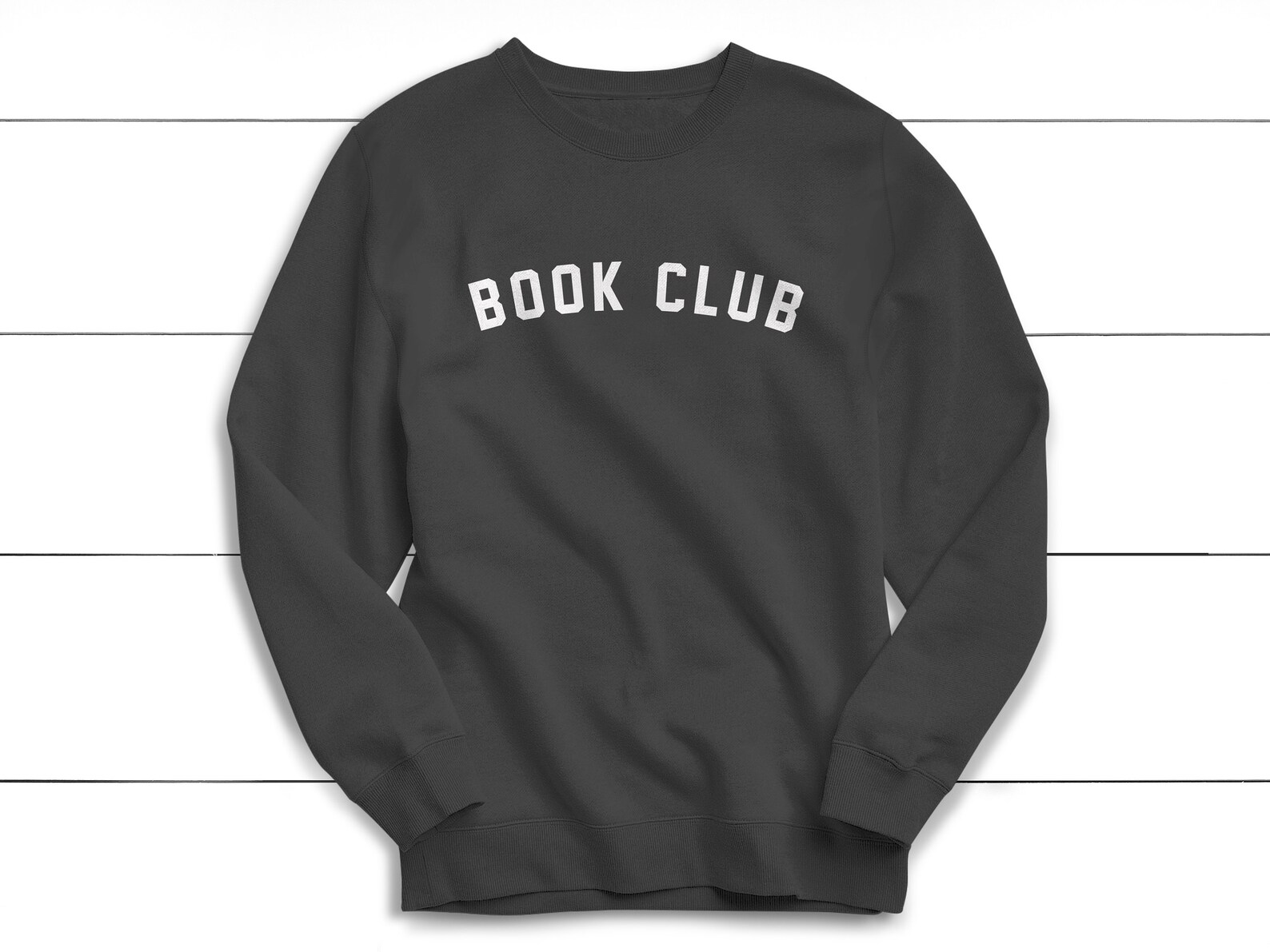 a black hoodie with the words "book club" in white