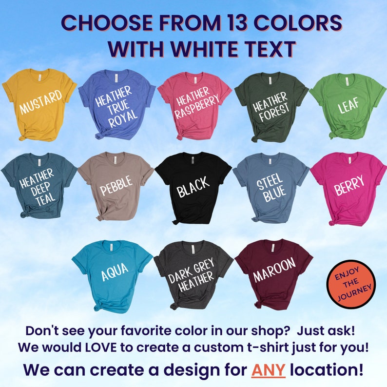 May include: A selection of 13 t-shirt colors with white text. The colors include mustard, heather true royal, heather raspberry, heather forest, leaf, heather deep teal, pebble, black, steel blue, berry, aqua, dark grey heather, and maroon. The text on the shirts reads "Choose from 13 colors with white text".