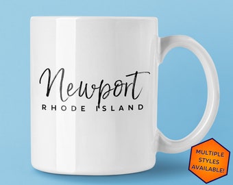 May include: White ceramic mug with a black handwritten design that says "Newport Rhode Island".
