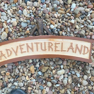 Adventureland sign walt disneyworld pirates of the caribbean swiss family treehouse enchanted tiki room image 4