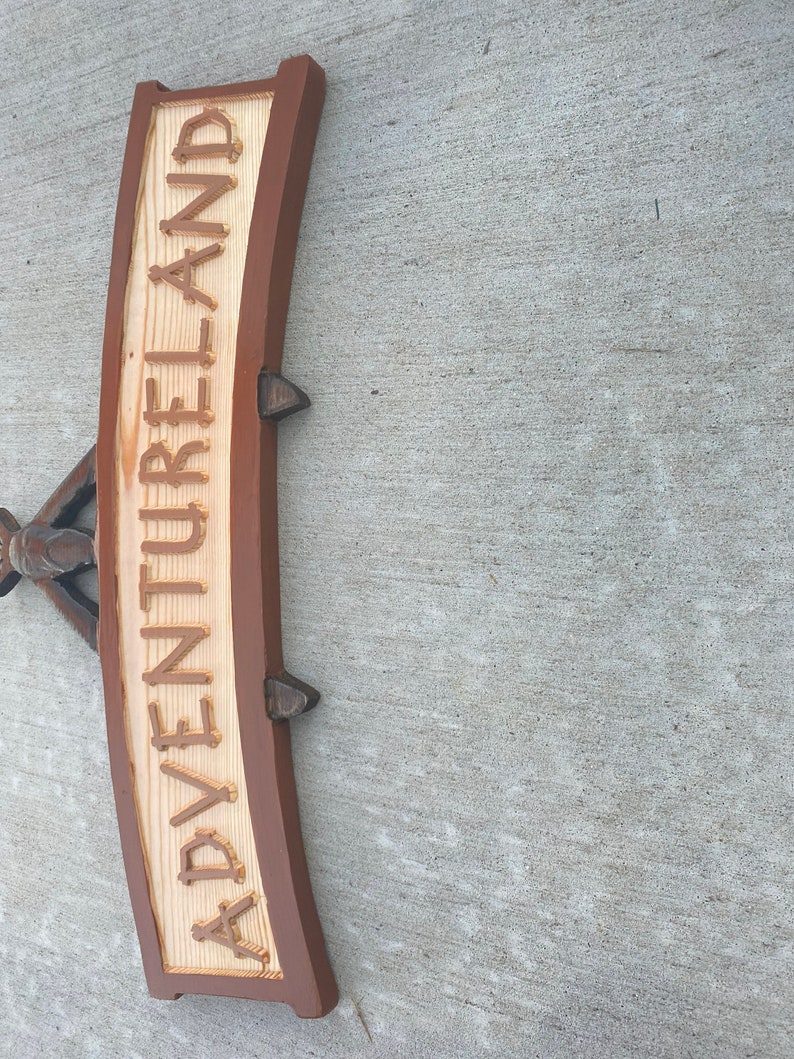 Adventureland sign walt disneyworld pirates of the caribbean swiss family treehouse enchanted tiki room image 9