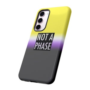 May include: A black phone case with a yellow, white, and purple gradient design. The case has a cutout for the camera and the text "NOT A PHASE" printed on it.