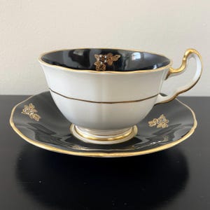 ADDERLEY | Vintage Teacup & Saucer | Bone China | Made in ENGLAND | Black and Gold with Iridescent Flowers | c. 1947 - 1950