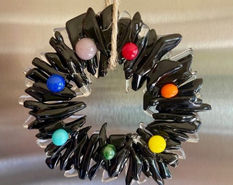 Modern fused glass Christmas Wreath ornament in black and clear glass with rainbow berries