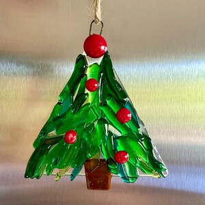 Fused glass tree ornament in different shades of green glass with some clear glass and red berries image 2