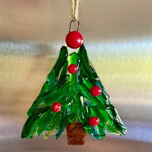 Fused glass tree ornament in different shades of green glass with some clear glass and red berries image 1