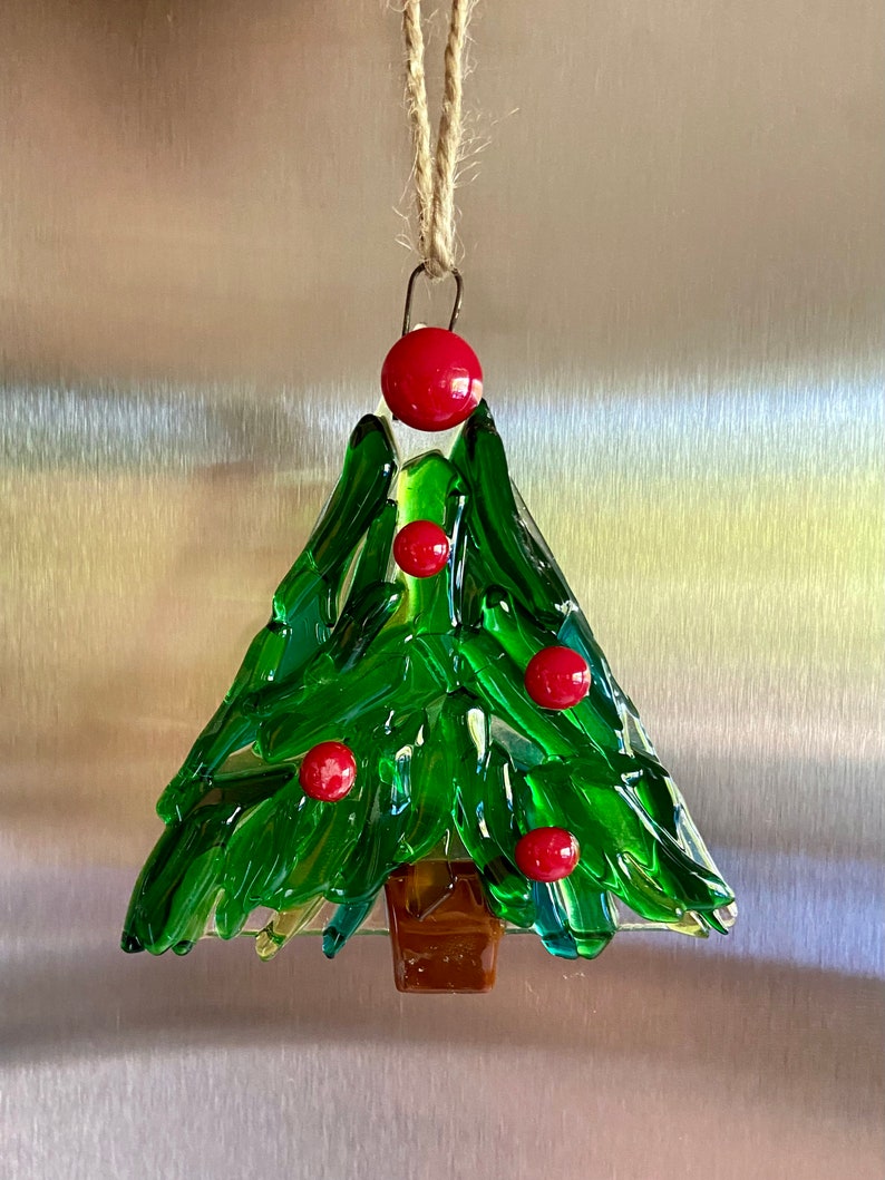 Fused glass tree ornament in different shades of green glass with some clear glass and red berries image 1