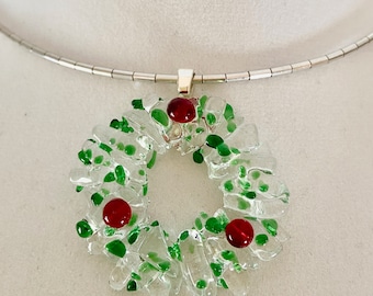 Christmas wreath pendant in fused Glass - base made with clear transparent glass , sprinkle of  green frit and red berries