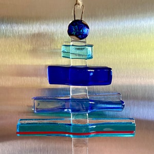 Fused Glass contemporary Christmas tree in different shades of blue with some red beach house ornament