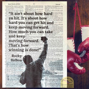 May include: A black and white image of a boxer with his fist raised in the air. The image is superimposed on a page of a dictionary with the text "It ain't about how hard ya hit. It's about how hard you can get hit and keep moving forward. How much you can take and keep moving forward. That's how winning is done!"  Rocky Balboa"