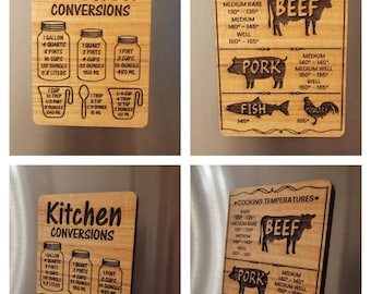 May include: Two wooden kitchen magnets with a rustic wood grain finish. The first magnet features a kitchen conversion chart with measurements in gallons, quarts, pints, cups, ounces, and milliliters. The second magnet features a cooking temperature chart for beef, pork, fish, and poultry with temperatures in degrees Fahrenheit.