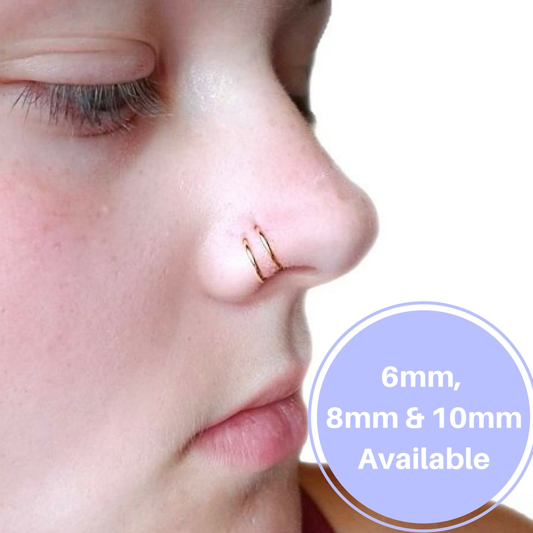 Septum and two shop nose piercings
