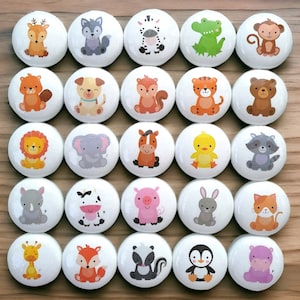 May include: Twenty-four round white buttons with colourful cartoon animal illustrations. The animals include a deer, wolf, zebra, alligator, monkey, squirrel, dog, fox, tiger, bear, lion, elephant, horse, duck, raccoon, rhino, cow, pig, rabbit, cat, giraffe, fox, skunk, penguin, and hippopotamus.