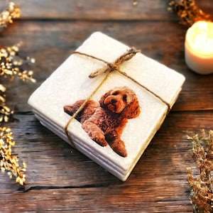 May include: A set of four white ceramic coasters with a brown dog printed on the top. The coasters are tied together with twine.