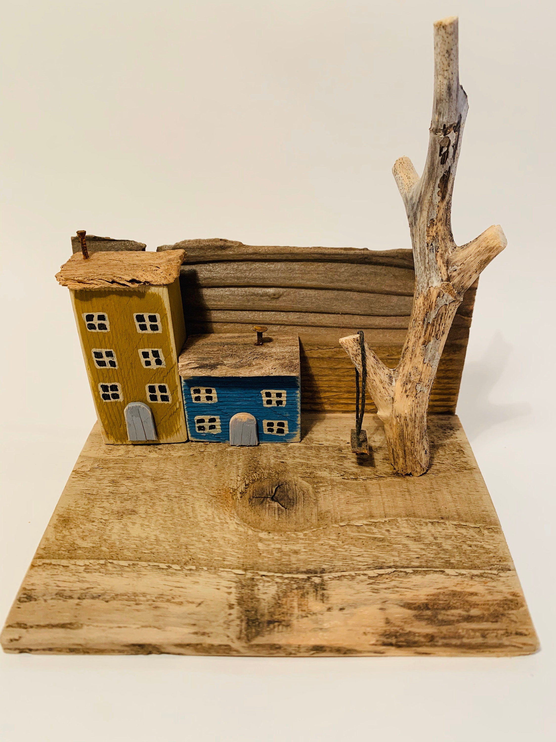 A beautiful and unique handcrafted driftwood house depicting a Etsy