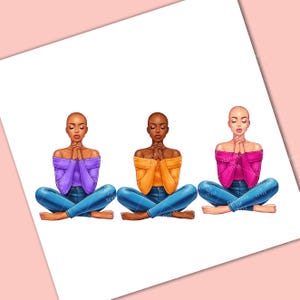 May include: Three women are sitting in a yoga pose with their hands clasped in prayer. They are wearing different colored tops: purple, orange, and pink. They are all wearing blue jeans.
