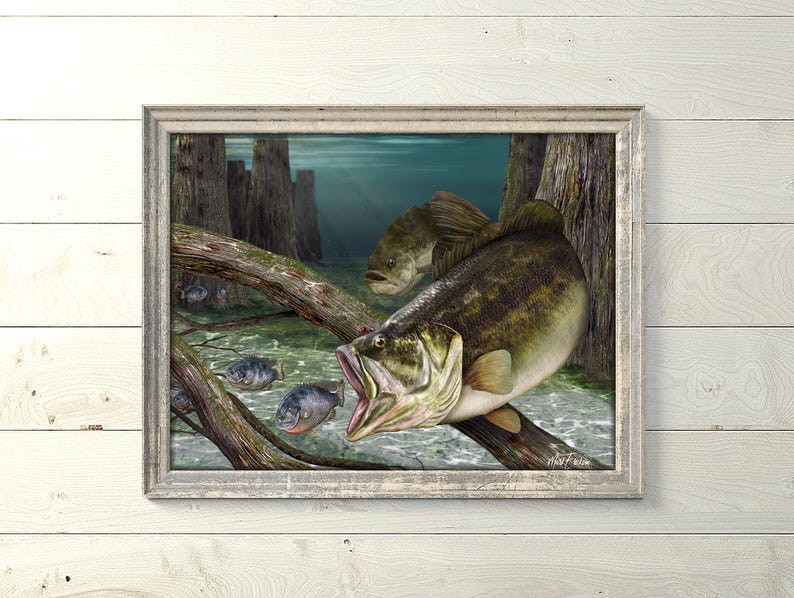 May include: A framed painting of a largemouth bass in a swampy setting. The bass is swimming towards the viewer with its mouth open. There are smaller fish swimming around the bass. The painting is set against a backdrop of trees and water.
