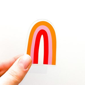 A cute illustrated orange, pink and red sticker.