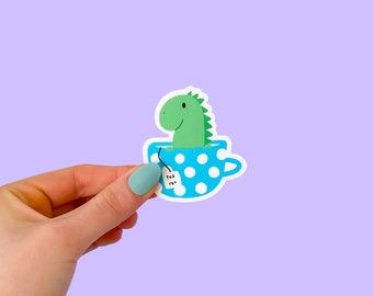 Tea Rex Sticker - Cute Illustrated Dinosaur in Teacup Pun Blue & Green Die Cut Vinyl, Laminated, Waterproof, Scratch Proof, Glossy Sticker