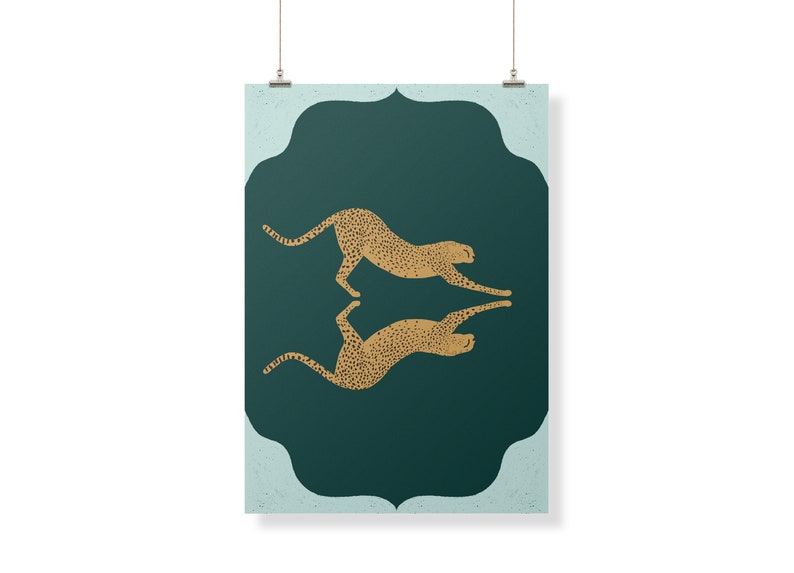 May include: A teal green poster with a gold cheetah silhouette design. The cheetah is facing right and is in a leaping pose. The cheetah is mirrored on the other side of the poster, facing left. The poster has a decorative border.