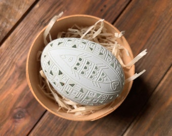 Ukrainian carved pysanka on araucana chicken egg: fish