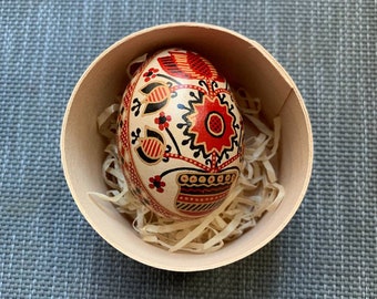 Ukrainian traditional pysanka on brown chicken egg