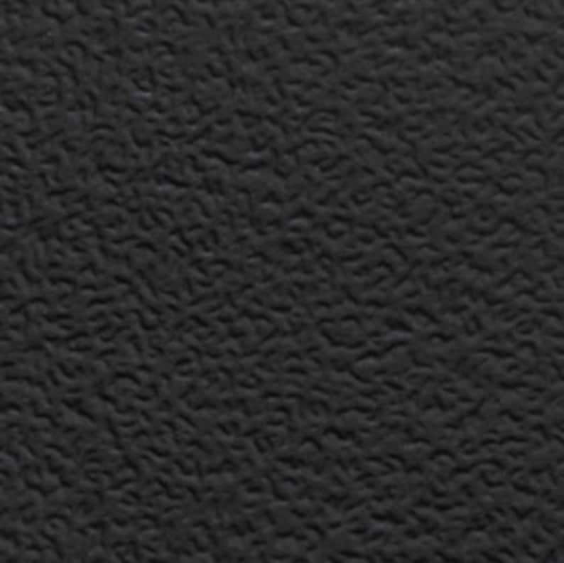 May include: Close-up of a black textured surface with a subtle pebbled pattern.