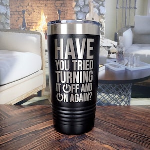 May include: A black stainless steel tumbler with a silver lid and the text "HAVE YOU TRIED TURNING IT OFF AND ON AGAIN?" with an on/off switch graphic.