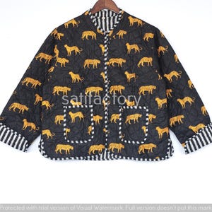 May include: Black quilted jacket with a repeating pattern of yellow leopards. The jacket has a mandarin collar, two pockets, and striped cuffs. The text "Satifactory" is visible on the jacket.