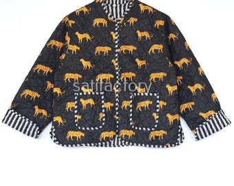 May include: Black quilted jacket featuring a repeating pattern of yellow leopards. The jacket has a mandarin collar, two pockets, and striped cuffs. The text "Satifactory" is visible on the jacket.