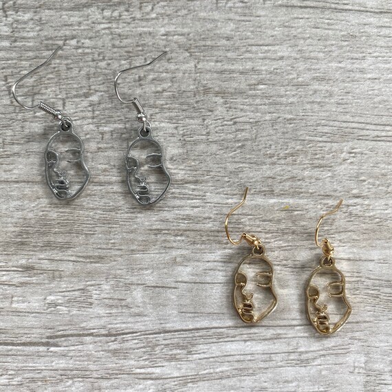 Pendientes de caras España