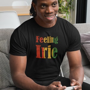 May include: A black t-shirt with the text "Feeling Irie" in red, yellow, and green letters. The letters have a distressed, vintage look.