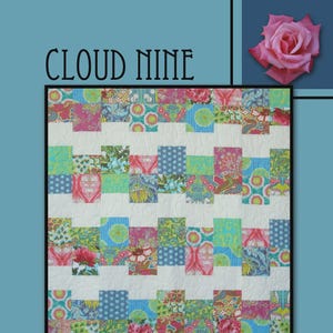 May include: A quilt pattern titled CLOUD NINE by Villa Rosa Designs featuring a grid of alternating white fabric blocks and colorful floral, polka dot, and paisley patterned fabric squares in shades of pink, green, and blue on a blue background.