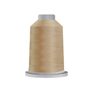 May include: A spool of light tan sewing thread wound tightly around a cylindrical core. The spool features a flat, light gray base and a matching light gray top cap, with the thread showing a smooth, consistent texture throughout the entire surface.