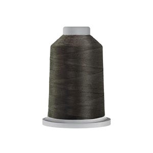 May include: A spool of dark charcoal gray sewing thread wound tightly around a cylindrical core. The thread features a smooth, consistent texture and is wrapped evenly from the base to the top, which is capped with a light gray plastic disc.