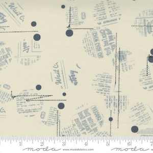 May include: A cream-colored fabric with a blue and white print of newspaper clippings and scattered blue polka dots. The fabric has a subtle texture and a ruler with markings in inches.