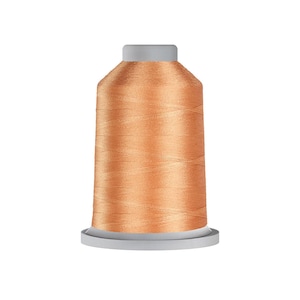 May include: A spool of copper-colored embroidery thread featuring a smooth, metallic sheen. The thread is tightly wound around a cylindrical core with a flat base and a slightly tapered top, showcasing a consistent, vibrant orange-toned metallic finish.
