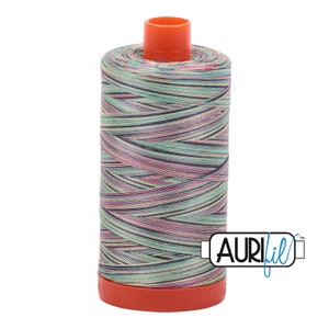 May include: A spool of Aurifil thread in a multi-colored variegated pattern with a light green, pink, and blue color scheme. The spool is orange and has the Aurifil logo on the side.