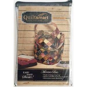 May include: A clear plastic package containing a Quiltsmart Mondo Bag printed interfacing kit. The packaging features a graphic of a patchwork bag, a stack of fabric, and text including Easy! Fast! Smart! and Mondo Bag on a wood-plank background.