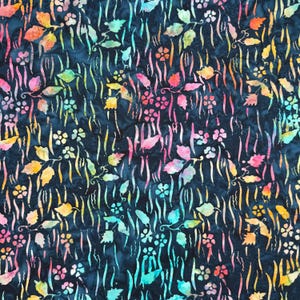 May include: A dark navy blue fabric featuring a batik-style pattern of multicolored leaves, small flowers, and vertical wavy lines in shades of pink, orange, yellow, and light blue, creating a vibrant contrast against the deep background.