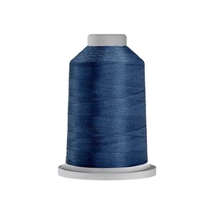May include: A spool of dark navy blue sewing thread featuring a cylindrical shape with a flat top and base. The thread is tightly wound around the central core, displaying a smooth, consistent texture and a deep, saturated blue color throughout.