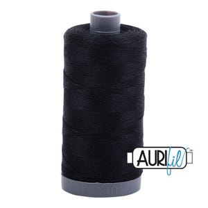 May include: A spool of black sewing thread with a grey plastic core. The spool features a grey base with the embossed text AURIFIL. A white rectangular logo with the black and blue text AURIFIL is positioned to the right of the thread spool.