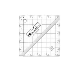 May include: A clear, square quilting ruler with grid lines and measurements in inches. The ruler has a diagonal line and the "Bloc-Loc" logo. The measurements are from 1 to 4 inches.
